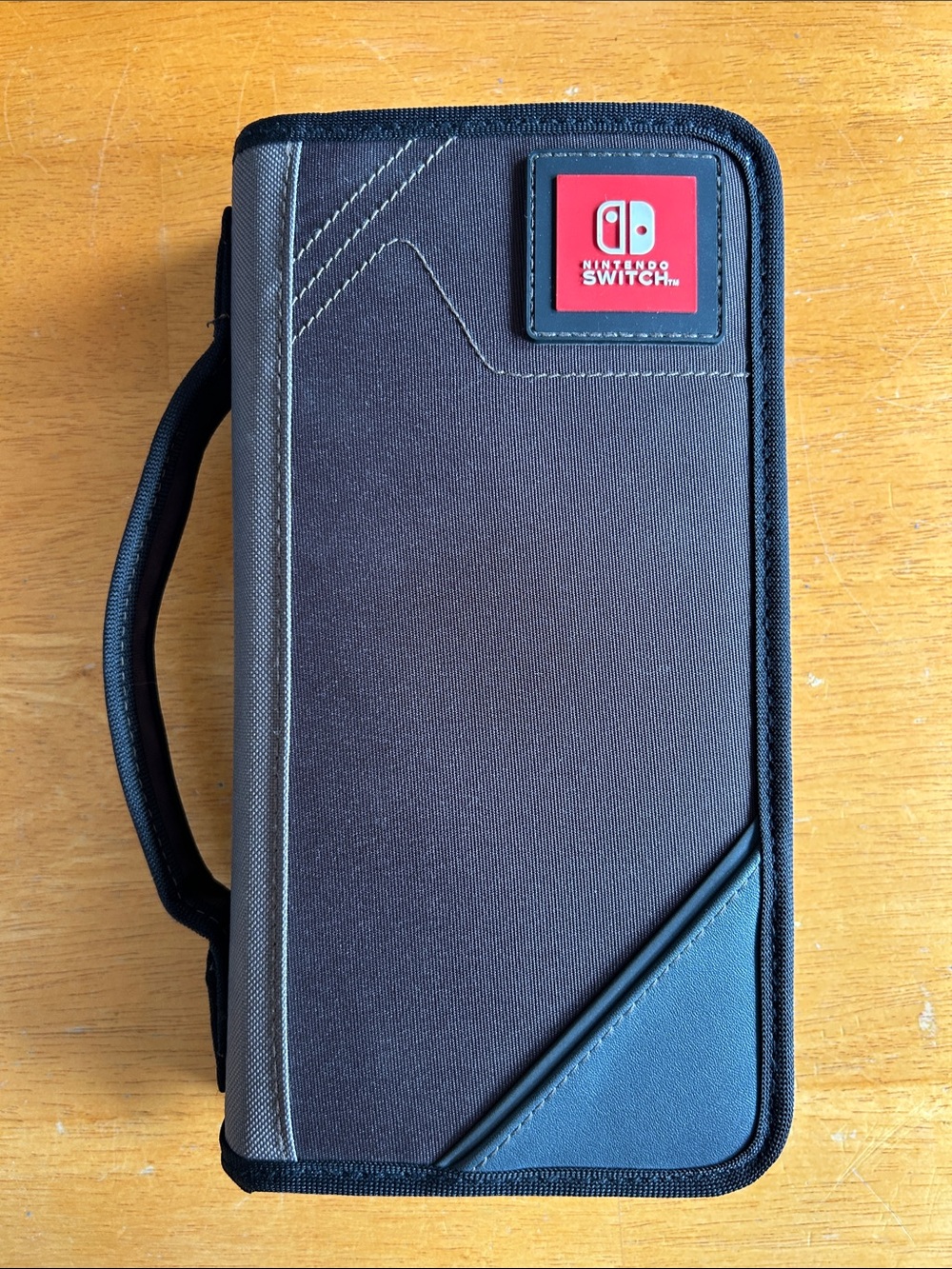Nintendo Switch Carrying Case in Brown, Black and Gray with Red Logo